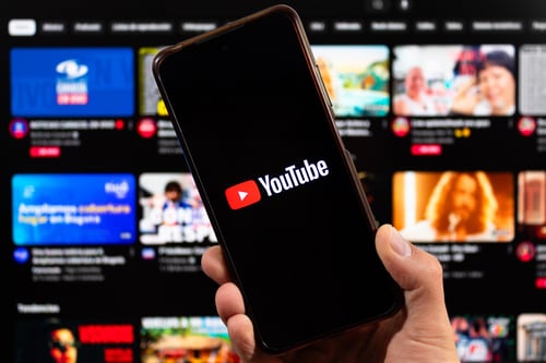 YouTube app on mobile phone, a powerful platform for improving brand promotion through video marketing.