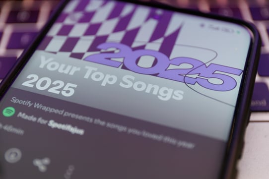 Smartphone displaying personalized year-in-review content for audience engagement.