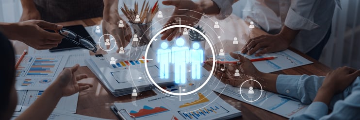 Team collaborating with AI analytics for customer insights and financial strategy.