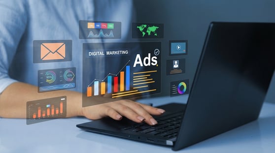 Professional using digital marketing tools on a laptop with analytics, ads, and performance dashboards