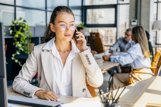 Sales team member in a follow-up call with client