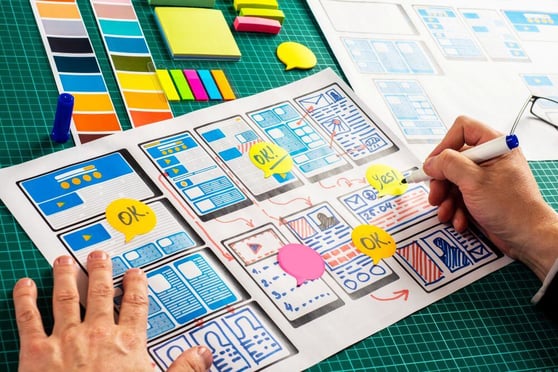Sketches and design planning showing how to create a high converting landing page with notes and layout drafts.