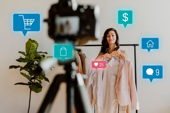 Influencer recording product video with social engagement icons for ecommerce marketing strategy.