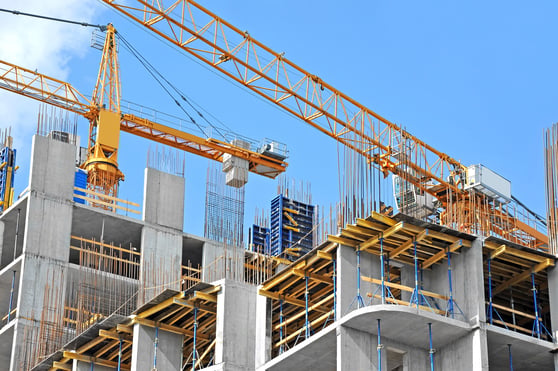 Crane and building construction site