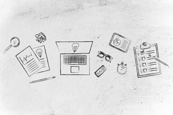 Competition is good and starts with smart planning—sketched workspace with laptop, reports, checklist, and business tools.