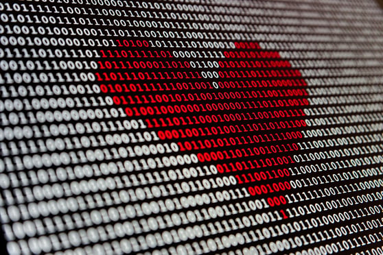 Binary code forming a heart shape symbolizing data-driven personalization in AI and marketing automation.