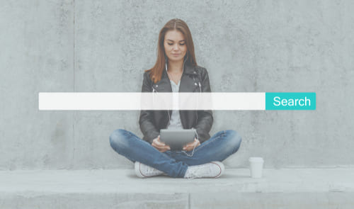 Person exploring search results, representing low competition keywords in SEO strategies.