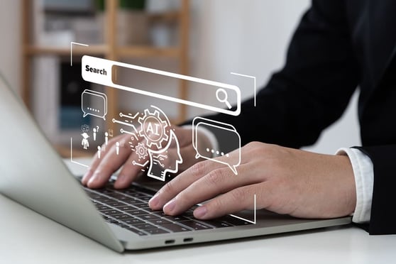 Person typing on laptop with AI search interface overlay illustrating what AI Overviews are in SGE search.
