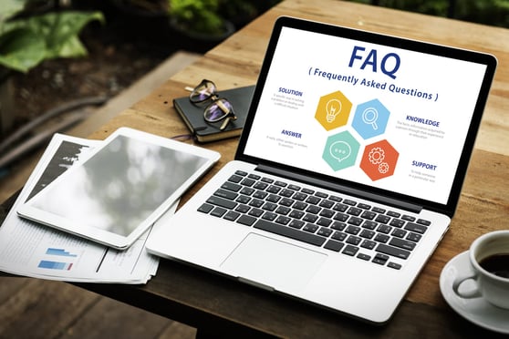 FAQ on a laptop screen